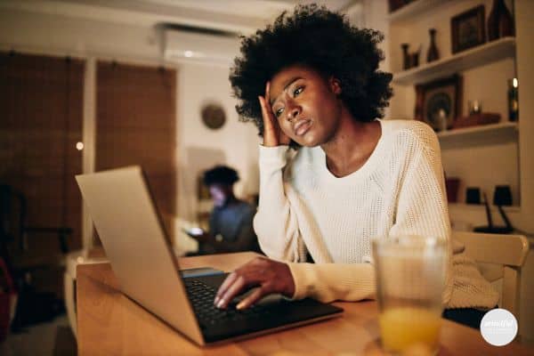 woman looking distressed from people pleasing tendencies.