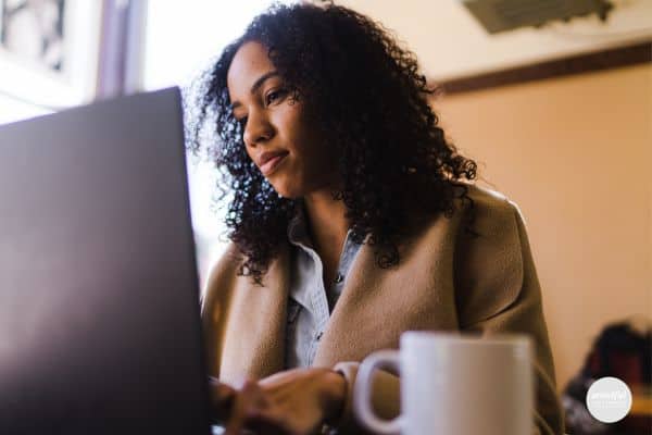 middle-age woman working on her laptop.