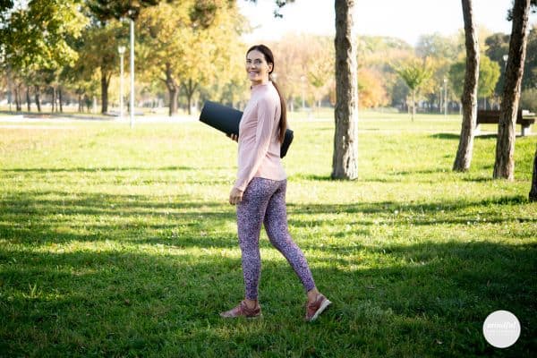 middle age woman utilizing movement to release stressed of midlife.