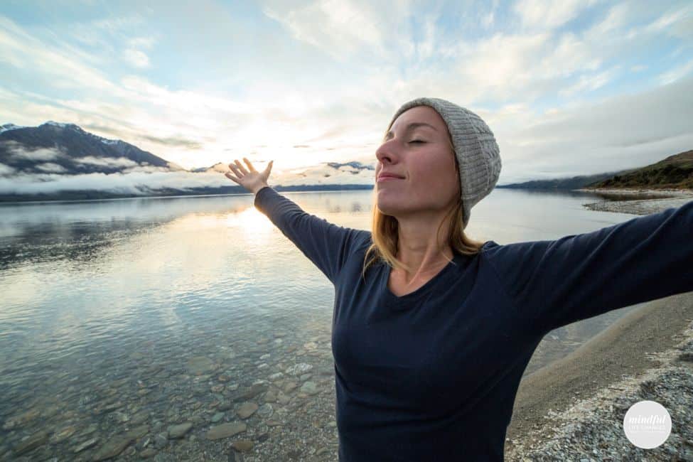 woman feeling empowered embracing the present moment.