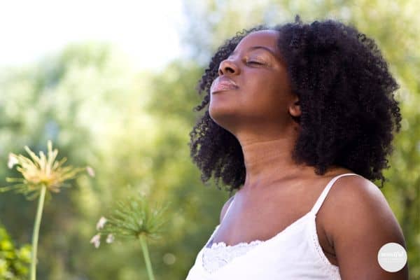 A woman taking in the moment for her own self-care