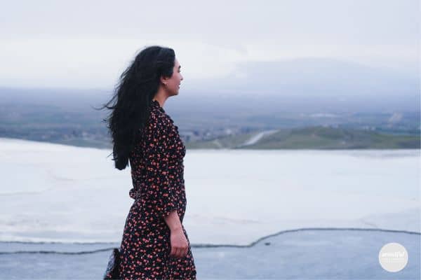 woman walking outside reflecting on her growth in midlife.